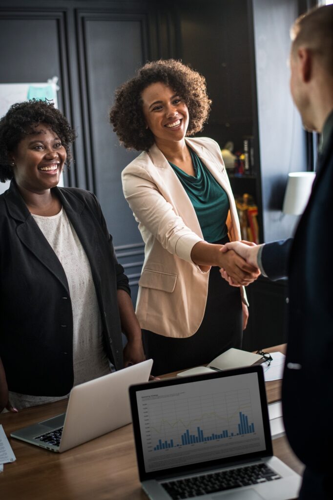 Business partners shaking hands in agreement