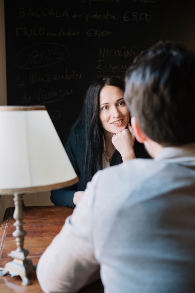 Elegant couple talking in a cafe